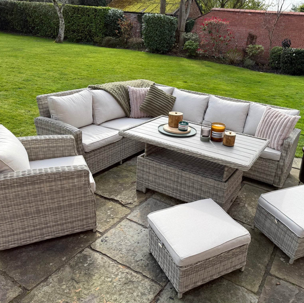Sienna Corner Rattan Garden Set with rising table, armchair, and footstools on patio